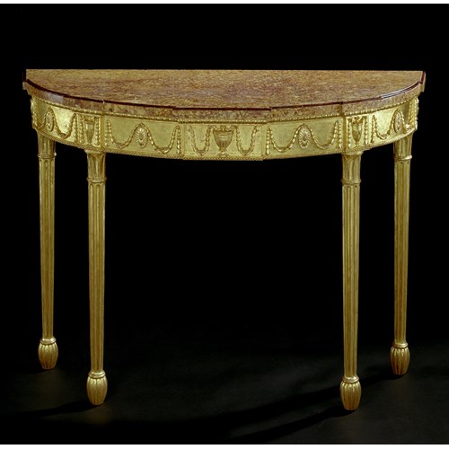 A GEORGE III CARVED GILTWOOD SIDE TABLE